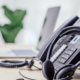 A modern office desk featuring a sophisticated VoIP phone system, highlighting the advanced communication technology used by businesses in Dallas. Keyword: voip phone systems dallas